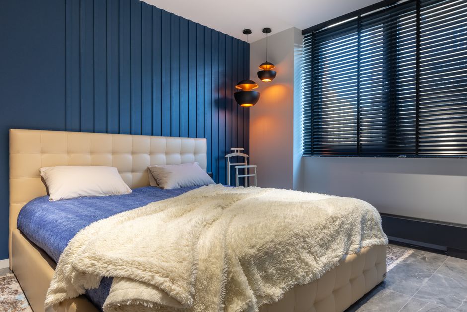 Modern bedroom with blackout roller shades
